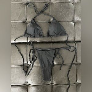 Matte Collection black two piece string bathing suit.